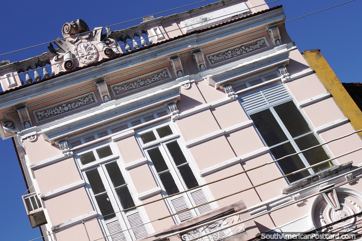 A swirl design at the top of this antique building facade in Manaus. (720x480px). Brazil, South America.