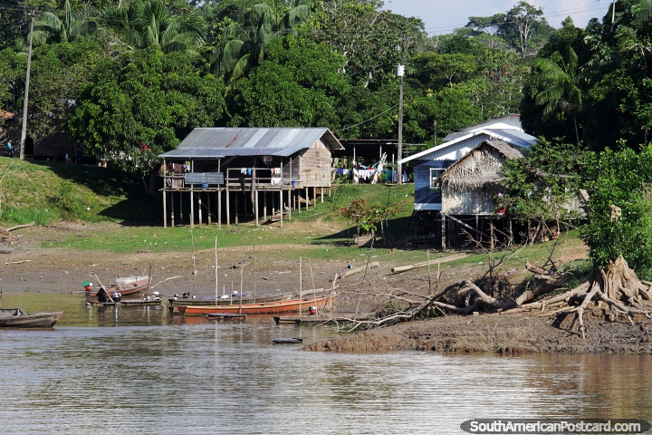 Boats moored in front of houses on the Amazon River. (720x480px). Brazil, South America.
