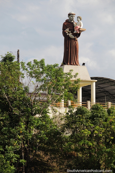 Religious monument overlooks the Amazon river in Santo Antonio do Ica. (480x720px). Brazil, South America.