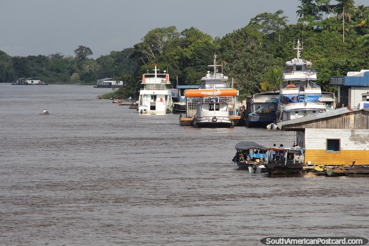 Boats and fuel stations along the side of the Amazon River in Santo Antonio do Ica. (720x480px). Brazil, South America.
