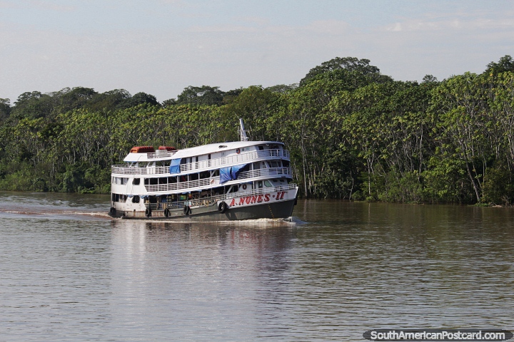 A.Nunes II, small hammock ferry cruising along the Amazon River. (720x480px). Brazil, South America.