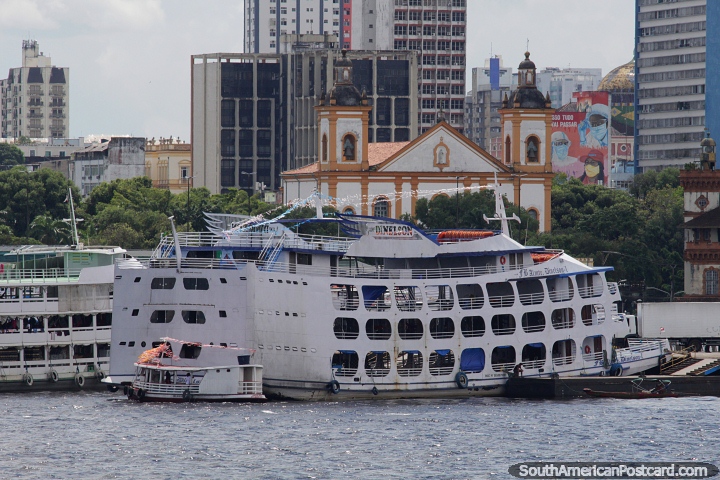 Passenger ferries docked in front of the cathedral in Manaus harbor. (720x480px). Brazil, South America.
