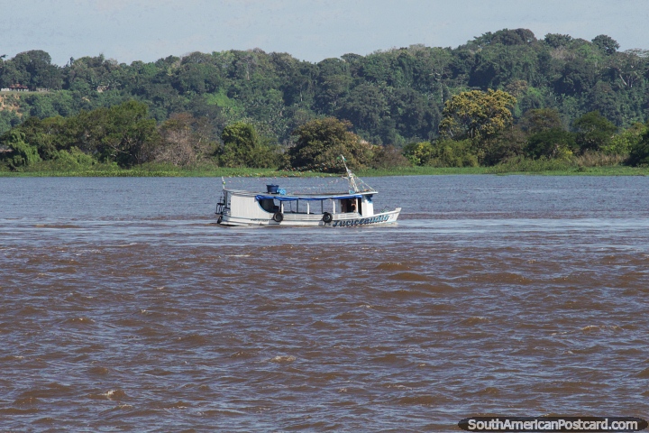 Luciclaudio, a small boat cruises on the Amazon River between Obidos and Santarem. (720x480px). Brazil, South America.