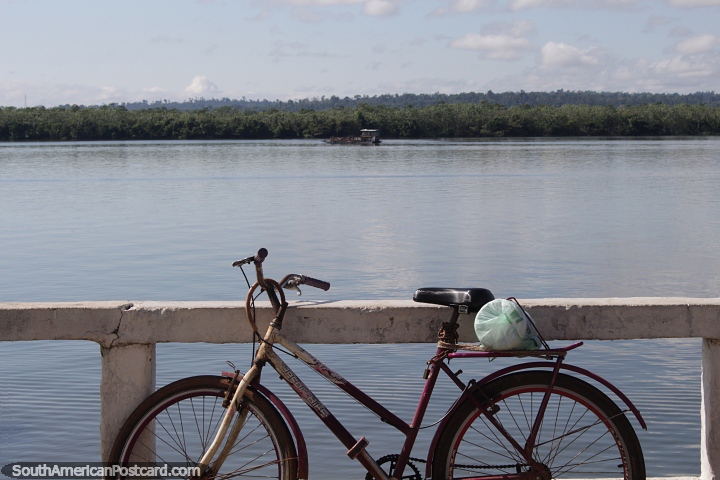 Xingu River in the morning in Altamira, a bicycle leans against the barrier. (720x480px). Brazil, South America.