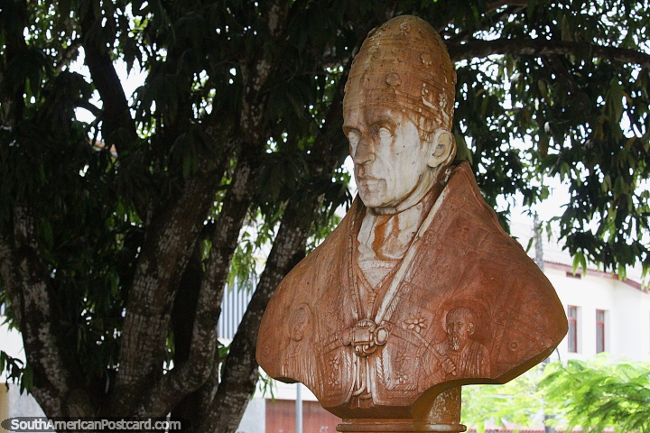 Religious monument in front of the church in Altamira, engraved figures. (720x480px). Brazil, South America.