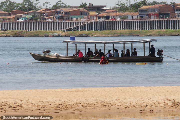 Long passenger boat full of people travels along the Tocantins River in Maraba. (720x480px). Brazil, South America.