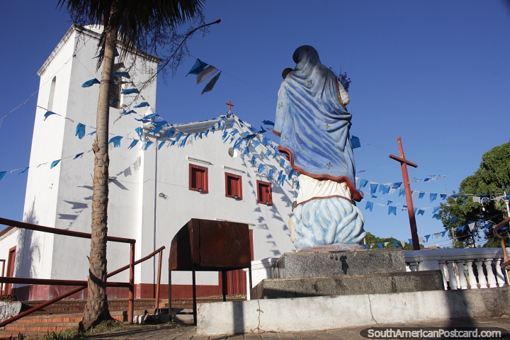 With a pair of brown wooden crosses, the white church in historic Cuiaba. (720x480px). Brazil, South America.
