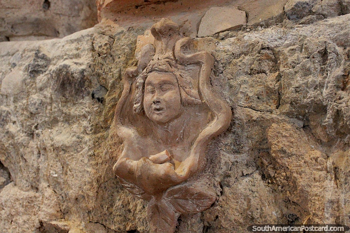 Face sculpted on a clay wall, Sao Jose da Ponta Grossa Fort, Florianopolis. (720x480px). Brazil, South America.