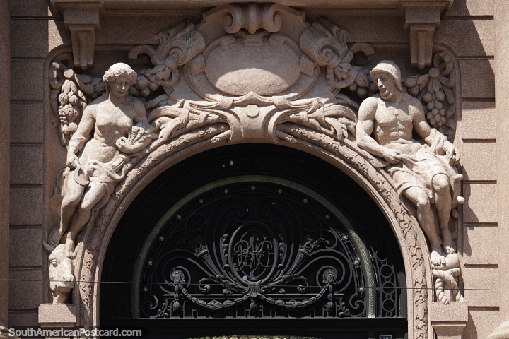 Ceramic figures above an arched building entrance in Porto Alegre. (720x480px). Brazil, South America.