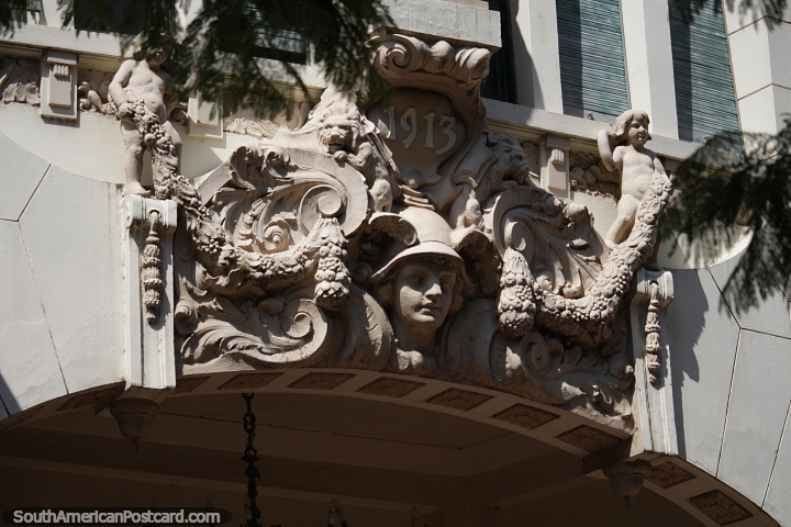 Detailed ceramic work above the entrance of an antique building from 1913 in Porto Alegre. (720x480px). Brazil, South America.