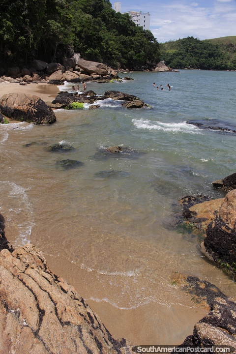 Freira Beach with boulders and clear waters in Caraguatatuba. (480x720px). Brazil, South America.