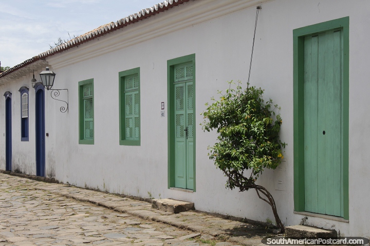 Series of doors and windows and white housefronts in Paraty. (720x480px). Brazil, South America.