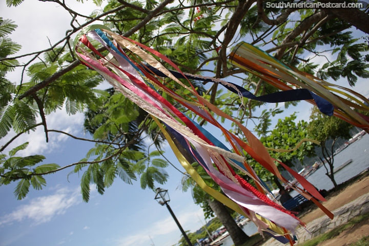 Colorful ribbons blow in the wind under trees at the seaside in Paraty. (720x480px). Brazil, South America.