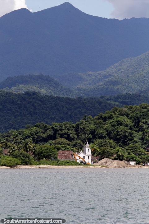 Church in front of the sea surrounded by rainforest and mountains in Paraty. (480x720px). Brazil, South America.