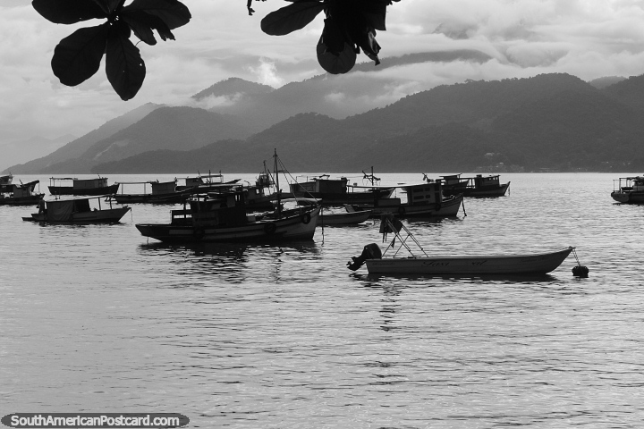 Boats in the bay and misty mountain ranges in Mangaratiba at days end. (720x480px). Brazil, South America.