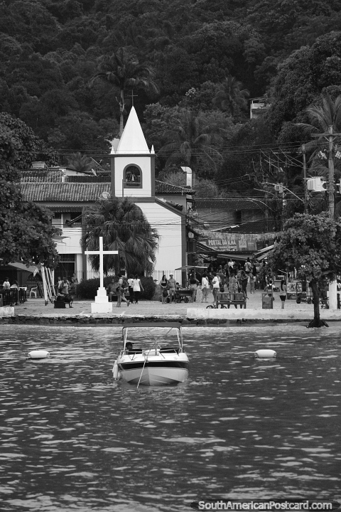 Church and cross on the seafront in Abraao, Ilha Grande. (480x720px). Brazil, South America.