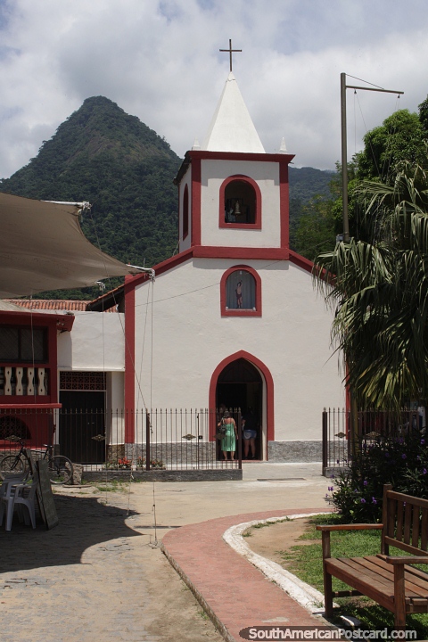 Church in a nice setting with the mountain peak behind in Abraao, Ilha Grande. (480x720px). Brazil, South America.