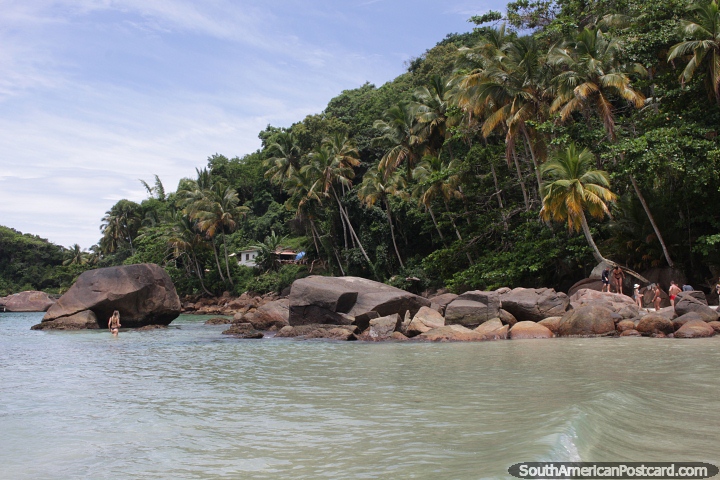 Beautiful beach scene on Ilha Grande with palm trees and boulders. (720x480px). Brazil, South America.