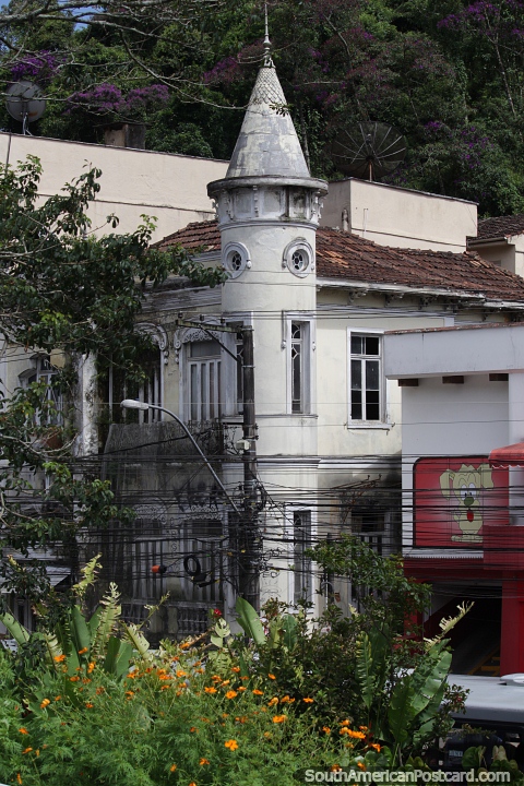 Antique building and architecture with a tower with portholes in Petropolis. (480x720px). Brazil, South America.