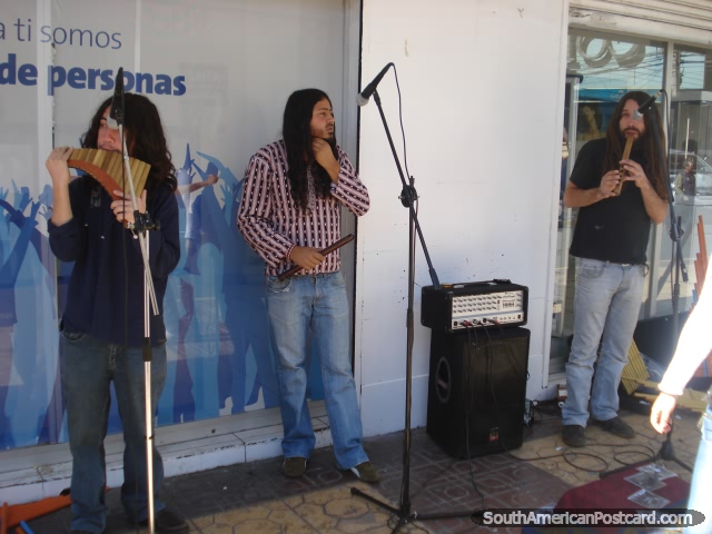 A group of buskers playing wind pipes in Calama. (640x480px). Chile, South America.