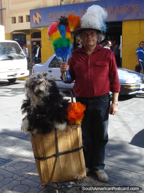 The Dust Brush Man with his colorful brushes on his head poses for a photo in Calama. (480x640px). Chile, South America.