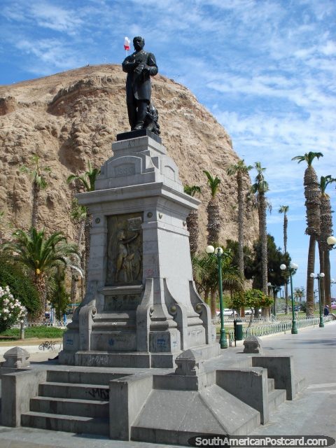 Statue, trees and headland in Arica. (480x640px). Chile, South America.