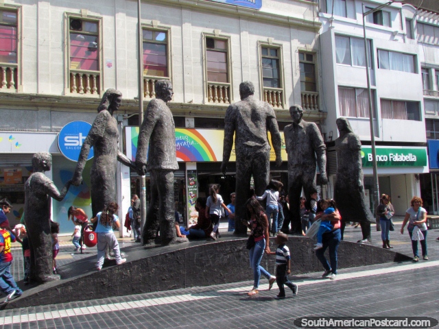 The 6 figures of the 'Alma del Pueblo' sculpture in Antofagasta dwarf the people walking by. (640x480px). Chile, South America.