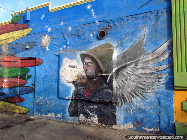 Man with wings blows a shell wall mural in Antofagasta. (640x480px). Chile, South America.