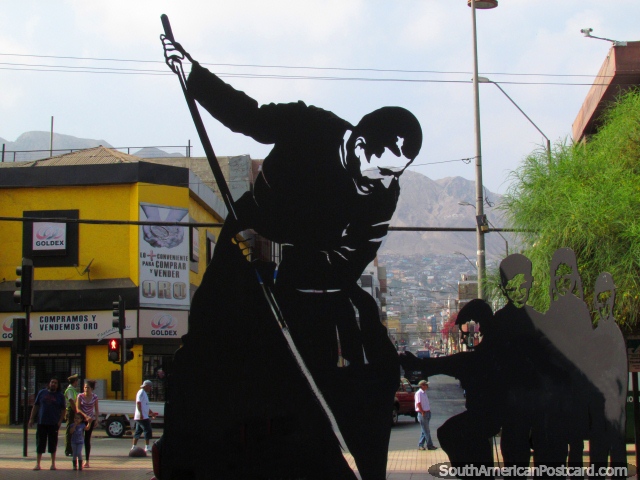 A black art piece of a man and children at Paseo Arturo Prat in Antofagasta. (640x480px). Chile, South America.