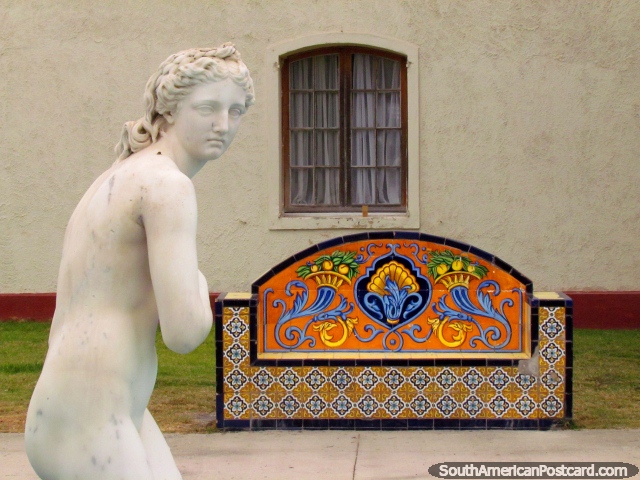 White female statue and a colored tile seat at the fortress in La Serena. (640x480px). Chile, South America.