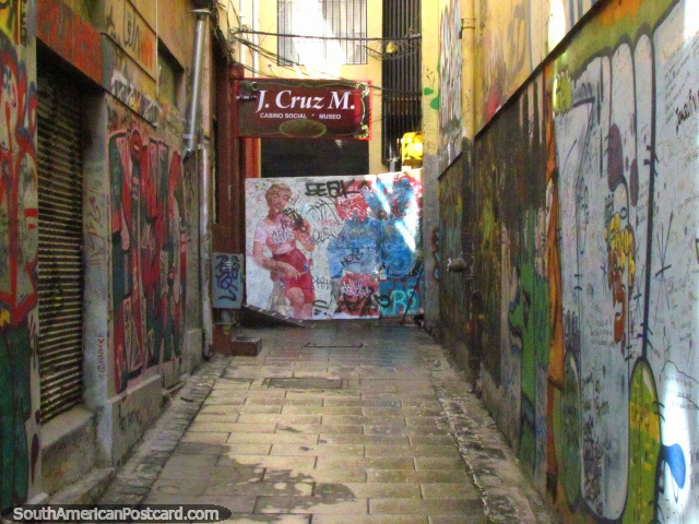 A dark alleyway in Valparaiso with an old Coca-Cola mural at the end. (640x480px). Chile, South America.