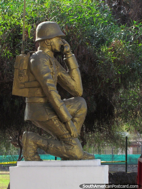 Gold monument of a military man at the army base in Iquique. (480x640px). Chile, South America.