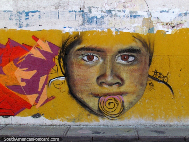 Girl eats candy, nice wall mural in Arica, yellow background. (640x480px). Chile, South America.