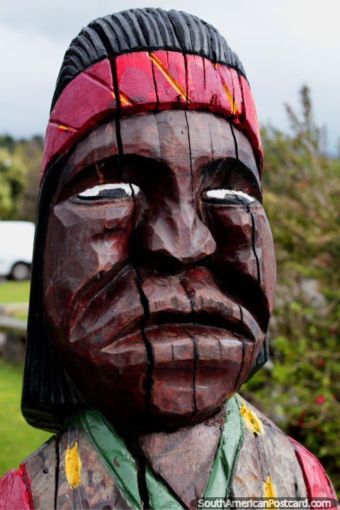 An indigenous chief, wood carving beside the lake in Pucon. (480x720px). Chile, South America.