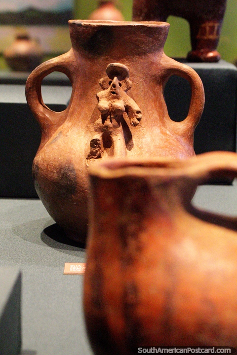 Ceramic vase with a small figure sculptured into it, Museum of History and Anthropology in Valdivia. (480x720px). Chile, South America.
