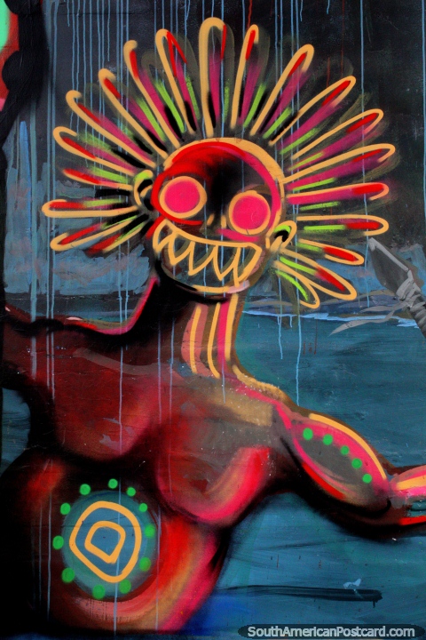 Arte callejero en Valdivia de un antiguo miembro de la tribu con mascarilla. (480x720px). Chile, Sudamerica.