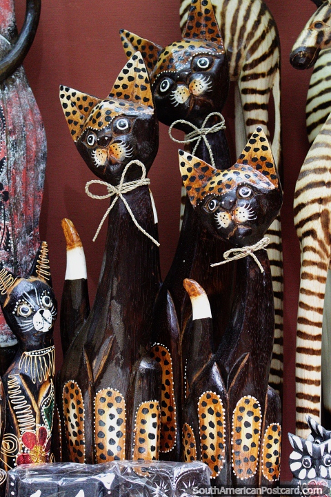 A group of wooden cats for sale at the arts and crafts market in Valdivia. (480x720px). Chile, South America.