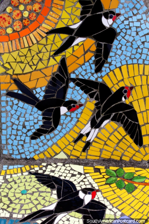 Birds ascending to the sky, tiled pictures at the plaza in Puerto Montt. (480x720px). Chile, South America.