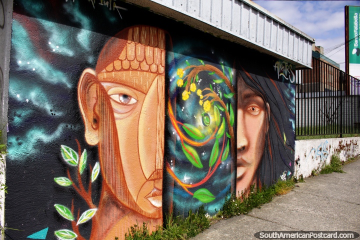 Street art in Puerto Montt, a pair of faces, indigenous and an alien. (720x480px). Chile, South America.