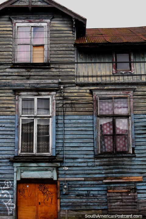 A very well-worn wooden house with 3 levels in Osorno. (480x720px). Chile, South America.