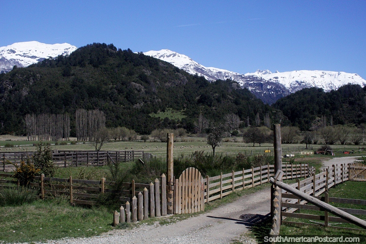 A real ranch entrance in the countryside heading south-west out of Futaleufu, snow-capped mountain ranges. (720x480px). Chile, South America.
