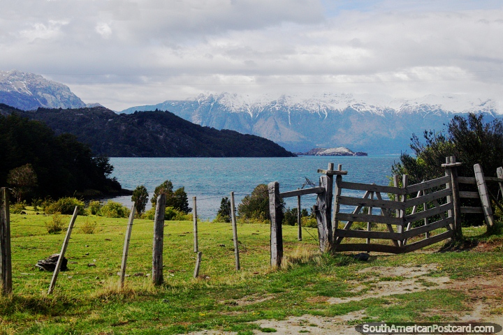 Great view of Lake General Carrera with a wooden fence and gate on grassland at Puerto Rio Tranquilo. (720x480px). Chile, South America.