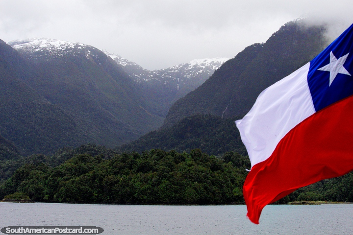 Chilean flag, green fjords and distant snow-caps, a ferry journey in the south. (720x480px). Chile, South America.
