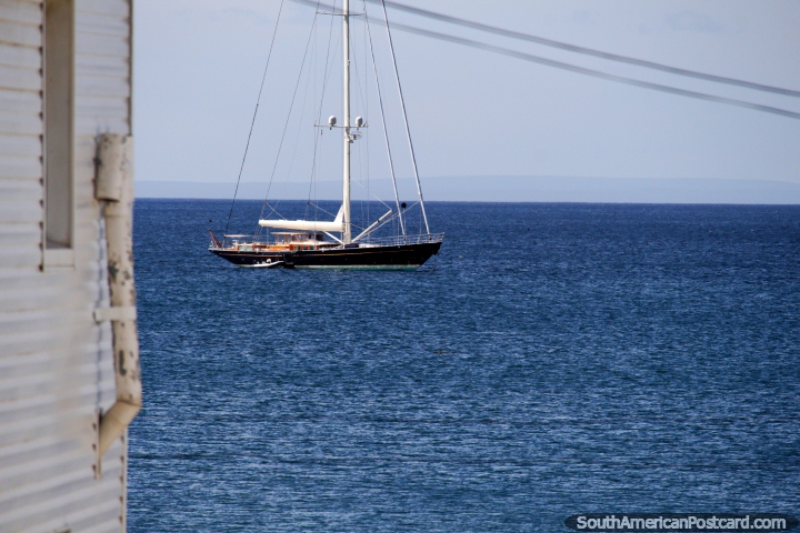 Sailboat in the harbor with deep blue seas on the waterfront in Punta Arenas. (720x480px). Chile, South America.