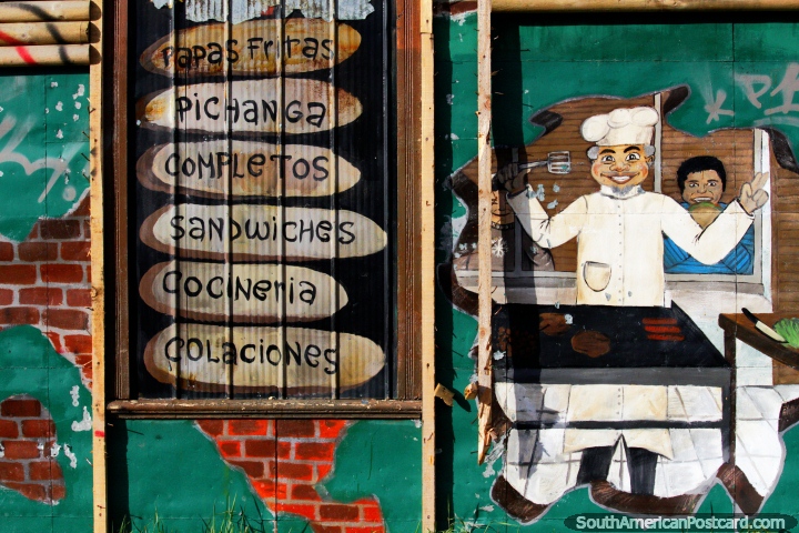 Antigua fachada de una panadera y tienda de comida rpida no utilizada en Punta Arenas, mural con panadero y lista de alimentos. (720x480px). Chile, Sudamerica.