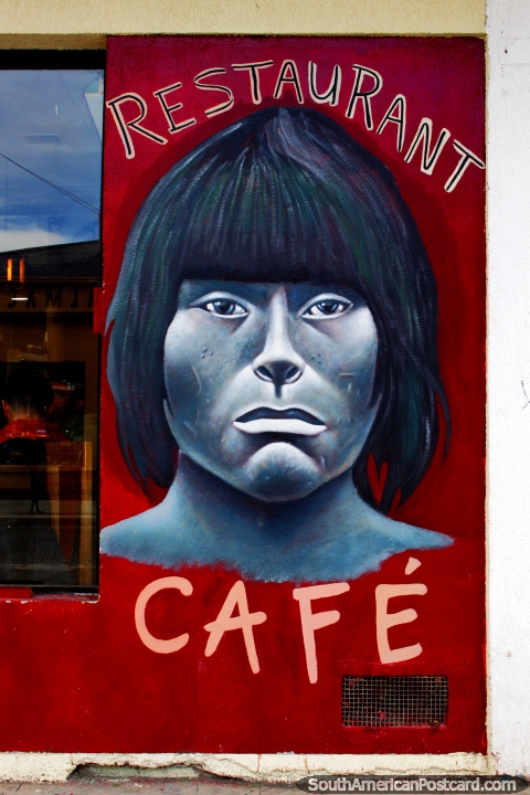 Una cara indgena pintada en un restaurante y cafetera en Puerto Natales. (480x720px). Chile, Sudamerica.