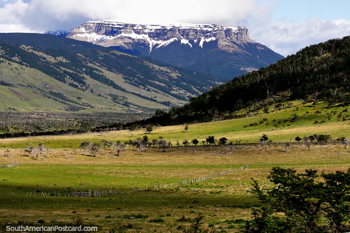 A tabletop mountain range with snow and the green terrain near Villa Cerro Castillo. (720x480px). Chile, South America.
