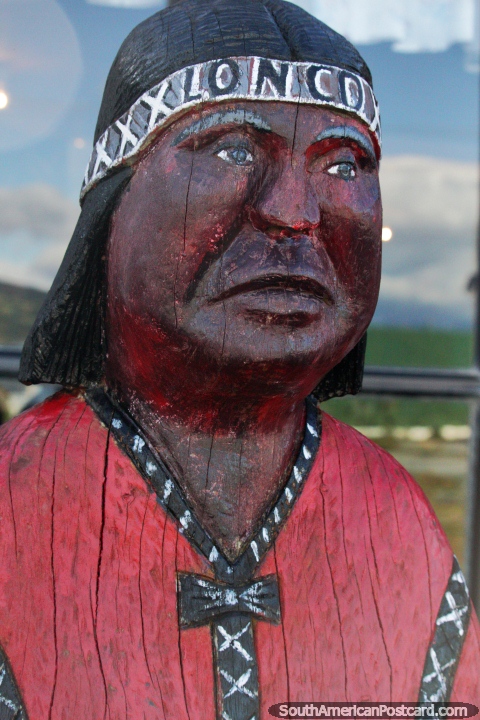 2nd wooden sculpture of an indigenous Indian at Villa Cerro Castillo. (480x720px). Chile, South America.