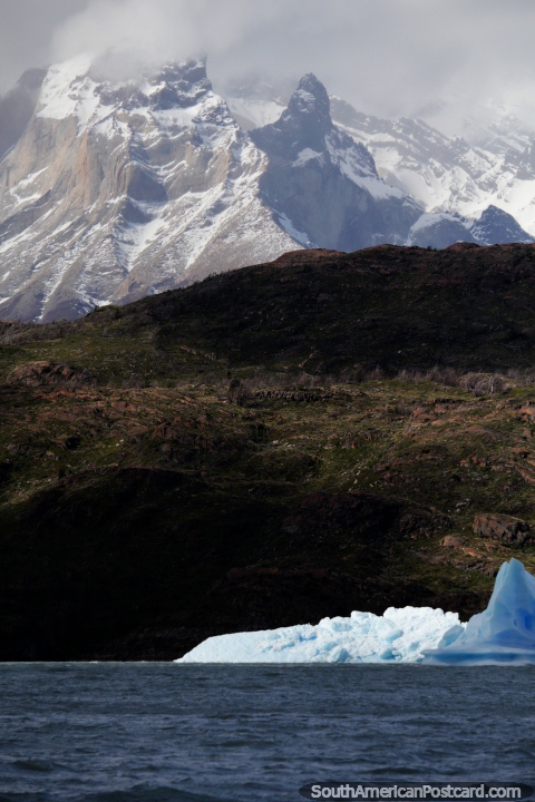 La luz se cuela a travs de las nubes sobre el hielo y las montaas en Glacier Grey, Torres del Paine. (480x720px). Chile, Sudamerica.