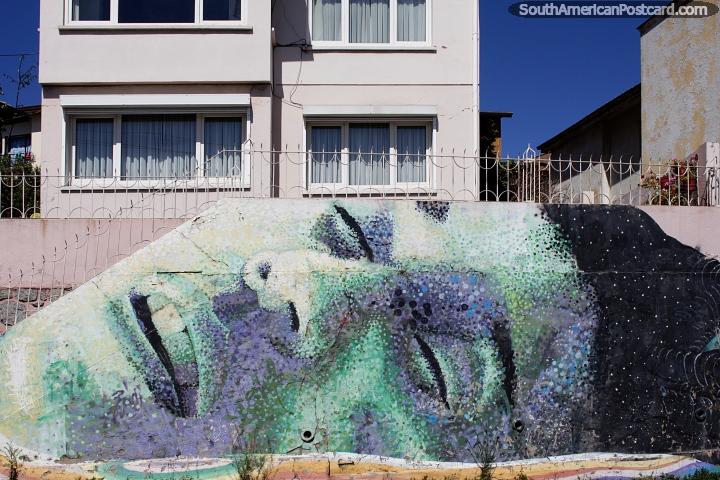 Spectacularly large mural of a person sleeping outside houses in Valparaiso. (720x480px). Chile, South America.